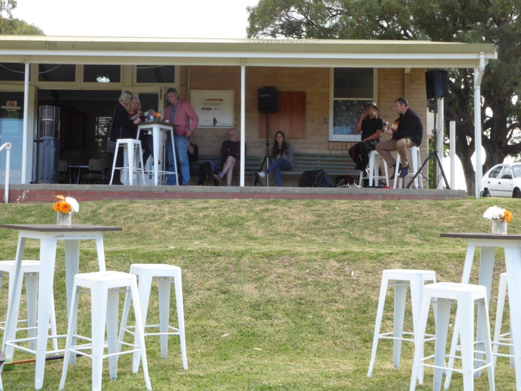 Live music on the veranda overlooking the lawns